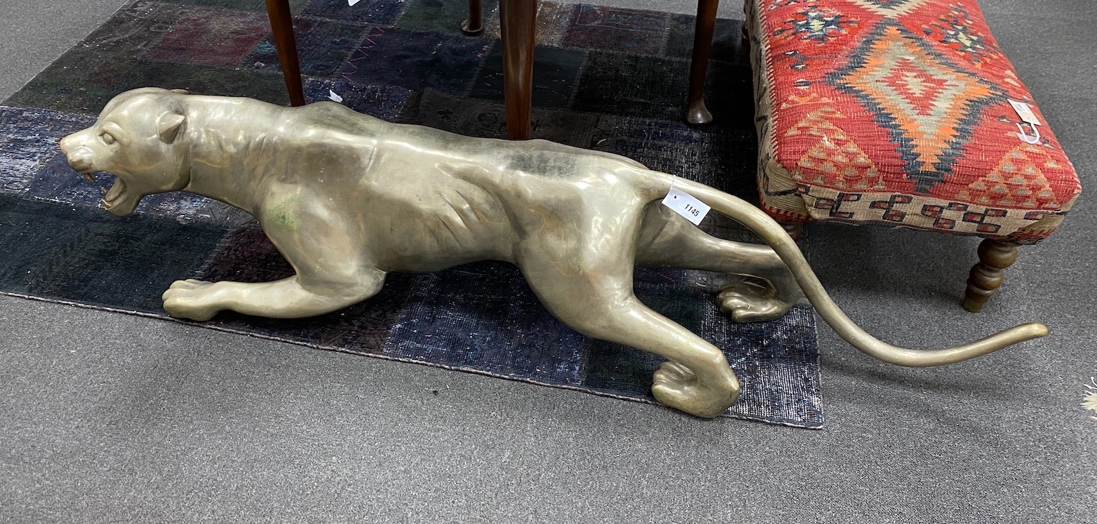 A large silvered bronze model of a panther, length 163cm